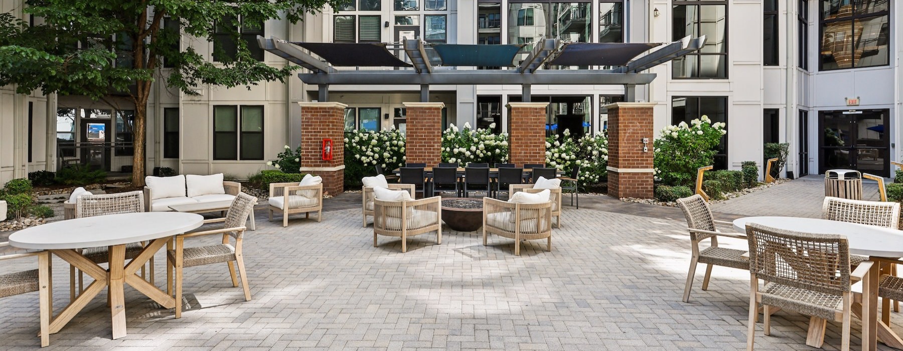 a courtyard with tables and chairs