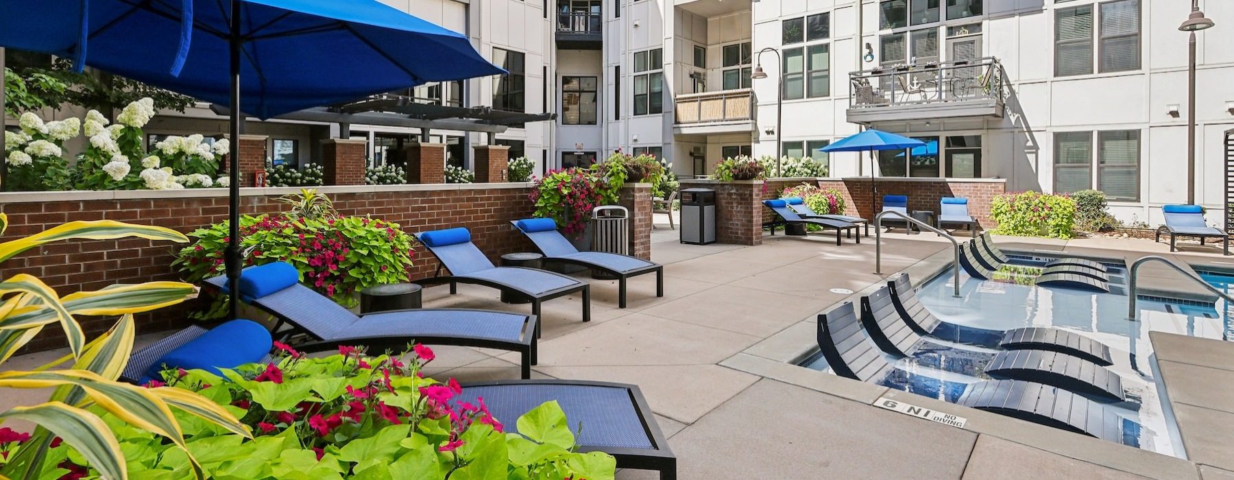 a pool with chairs and an umbrella
